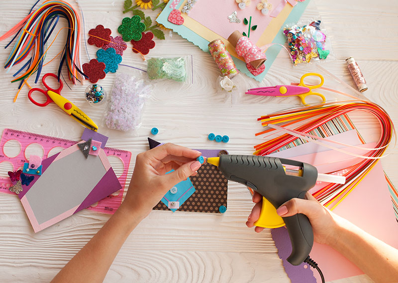 Top view of table with elements for scrapbooking, tools for deco Craft table